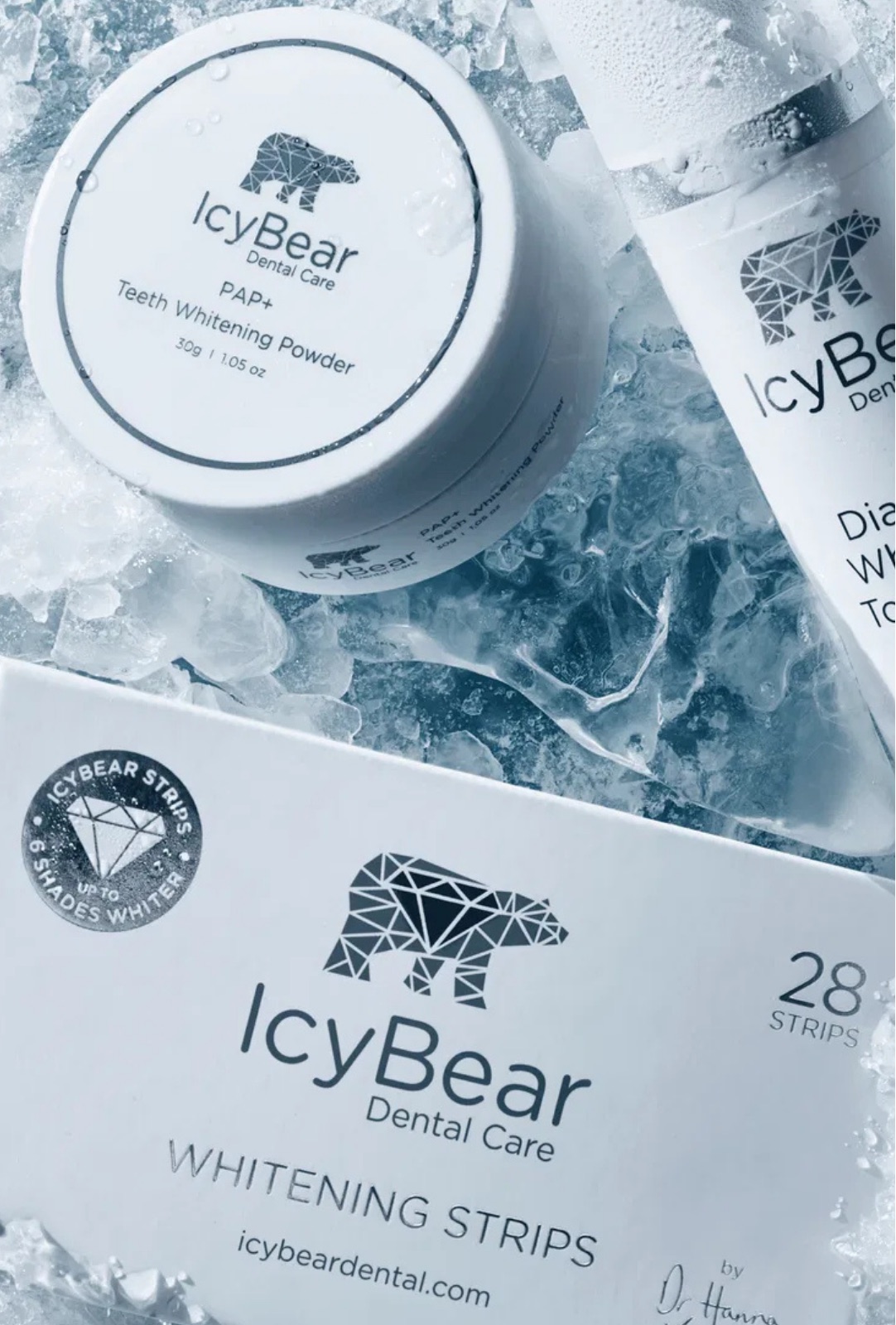 Icy Bear whitening powder, toothpaste and strips on crushed ice
