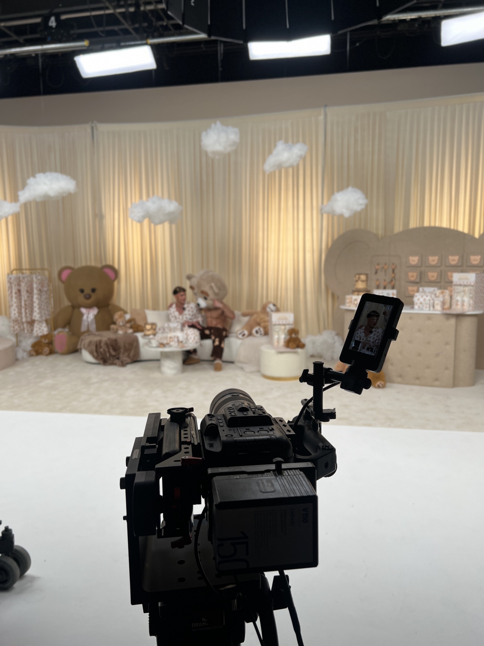 Crew members working on a teddy-bear themed LIVE set