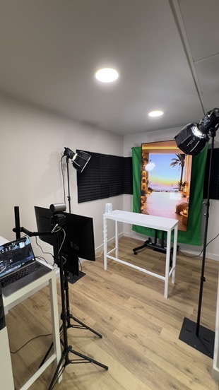 A host on camera under studio lighting